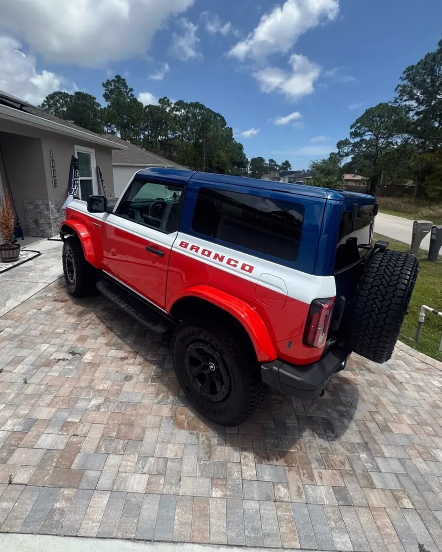 A red and white Ford Bronco after a detail